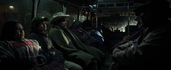 Movie still from “Sicario: Day of the Soldado” (2018), directed by Stefano Sollima – A man in a cowboy hat sitting on a bus; Medium shot, High angle