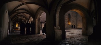 Movie still from “The Sound of Music” (1965), directed by Robert Wise – A group of people standing inside of an old building; Extreme Wide shot, High angle