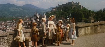 Movie still from “The Sound of Music” (1965), directed by Robert Wise – A group of people standing on top of a building; Wide shot, High angle
