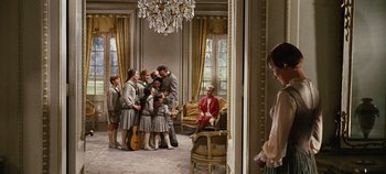 Movie still from “The Sound of Music” (1965), directed by Robert Wise – A group of people standing in a living room; Wide shot, Over the shoulder angle