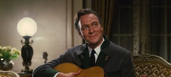 Movie still from “The Sound of Music” (1965), directed by Robert Wise – A person holding a guitar; Close Up shot, Low angle
