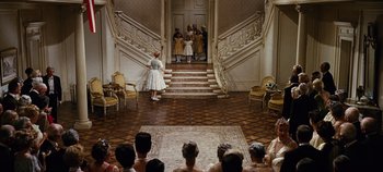 Movie still from “The Sound of Music” (1965), directed by Robert Wise – A group of people standing in front of a staircase; Wide shot, High angle