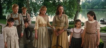 Movie still from “The Sound of Music” (1965), directed by Robert Wise – Two women and a little girl standing next to each other; Medium shot, Low angle