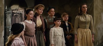 Movie still from “The Sound of Music” (1965), directed by Robert Wise – A group of people standing next to each other; Medium shot, Low angle