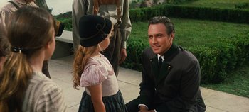 Movie still from “The Sound of Music” (1965), directed by Robert Wise – A man and a little girl talking to each other; Medium shot, Over the shoulder angle