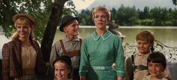 Movie still from “The Sound of Music” (1965), directed by Robert Wise – A man and a woman standing next to each other; Medium shot, Low angle