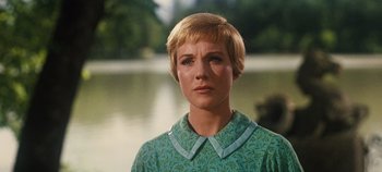 Movie still from “The Sound of Music” (1965), directed by Robert Wise – A woman with blonde hair wearing a green shirt; Close Up shot, Low angle