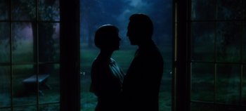 Movie still from “The Sound of Music” (1965), directed by Robert Wise – A man and a woman standing next to each other in front of a window; Medium shot, Low angle