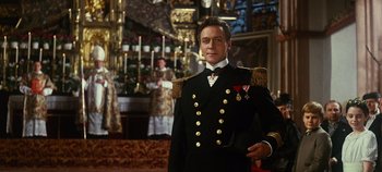 Movie still from “The Sound of Music” (1965), directed by Robert Wise – A man in a uniform standing in front of a room; Medium shot, Low angle