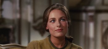 Movie still from “The Sound of Music” (1965), directed by Robert Wise – A person wearing a sweater looking at the camera; Close Up shot, Over the shoulder angle
