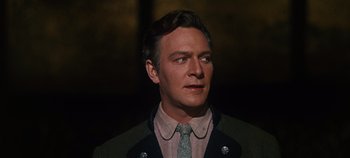Movie still from “The Sound of Music” (1965), directed by Robert Wise – A person wearing a suit and tie; Close Up shot, Low angle