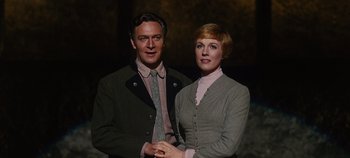 Movie still from “The Sound of Music” (1965), directed by Robert Wise – A man and a woman standing next to each other; Medium shot, Low angle