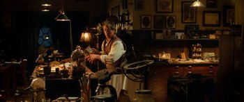 Movie still from “The Spiderwick Chronicles” (2008), directed by Mark Waters – An old man in a white shirt and a brown vest; Medium shot, Over the shoulder angle