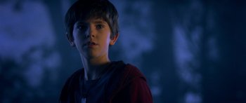 Movie still from “The Spiderwick Chronicles” (2008), directed by Mark Waters – A young boy is looking into the distance; Close Up shot, Over the shoulder angle
