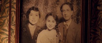 Movie still from “The Spiderwick Chronicles” (2008), directed by Mark Waters – An old photo of a man and two women; Close Up shot, High angle