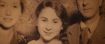Movie still from “The Spiderwick Chronicles” (2008), directed by Mark Waters – An old photo of a young girl with long hair; Extreme Close Up shot, High angle