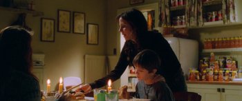 Movie still from “The Spiderwick Chronicles” (2008), directed by Mark Waters – A woman and a boy sitting at a dinner table; Medium shot, Over the shoulder angle
