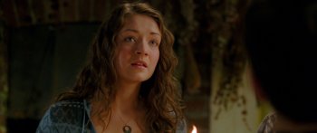 Movie still from “The Spiderwick Chronicles” (2008), directed by Mark Waters – A woman with long brown curly hair stares into the distance; Close Up shot, Over the shoulder angle