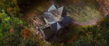 Movie still from “The Spiderwick Chronicles” (2008), directed by Mark Waters – An aerial view of an old house in the middle of a field; Extreme Wide shot, Overhead angle