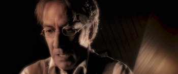 Movie still from “The Spiderwick Chronicles” (2008), directed by Mark Waters – An older man wearing glasses looking at the camera; Close Up shot, Low angle