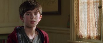 Movie still from “The Spiderwick Chronicles” (2008), directed by Mark Waters – A young boy is looking into the distance; Close Up shot, Over the shoulder angle