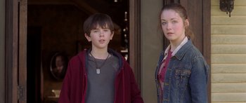 Movie still from “The Spiderwick Chronicles” (2008), directed by Mark Waters – A boy and a girl standing next to each other; Medium shot, Over the shoulder angle