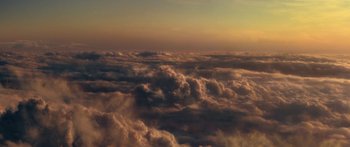 Movie still from “The Spiderwick Chronicles” (2008), directed by Mark Waters – A view of the sky from a plane window at sunset; Extreme Wide shot, High angle