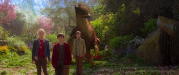 Movie still from “The Spiderwick Chronicles” (2008), directed by Mark Waters – Two young men standing in front of a large animal; Wide shot, Low angle