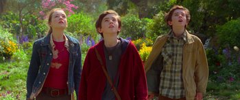 Movie still from “The Spiderwick Chronicles” (2008), directed by Mark Waters – A group of people standing next to each other in a field; Medium shot, Low angle