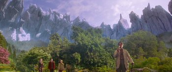Movie still from “The Spiderwick Chronicles” (2008), directed by Mark Waters – A group of people standing in front of a mountain; Extreme Wide shot, Low angle