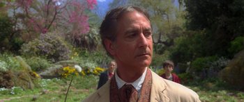 Movie still from “The Spiderwick Chronicles” (2008), directed by Mark Waters – A person wearing a suit and tie; Close Up shot, Over the shoulder angle