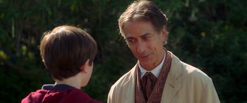 Movie still from “The Spiderwick Chronicles” (2008), directed by Mark Waters – An older man and a young boy in a park; Close Up shot, Over the shoulder angle