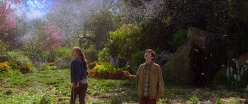 Movie still from “The Spiderwick Chronicles” (2008), directed by Mark Waters – A boy and a girl standing in a garden; Wide shot, Low angle