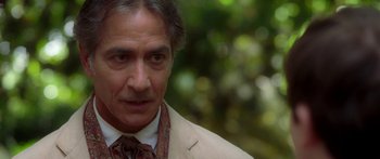 Movie still from “The Spiderwick Chronicles” (2008), directed by Mark Waters – A person wearing a suit and tie; Close Up shot, Over the shoulder angle