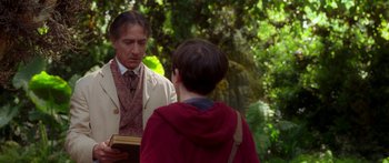 Movie still from “The Spiderwick Chronicles” (2008), directed by Mark Waters – A man and a woman are standing in the woods; Medium shot, Over the shoulder angle