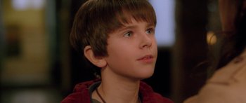 Movie still from “The Spiderwick Chronicles” (2008), directed by Mark Waters – A young boy is looking to his left; Close Up shot, Over the shoulder angle