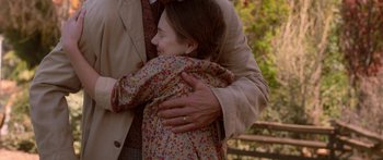 Movie still from “The Spiderwick Chronicles” (2008), directed by Mark Waters – A man and a woman hugging each other outside; Medium shot, Over the shoulder angle