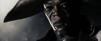 Movie still from “The Spirit” (2008), directed by Frank Miller – A person wearing a cowboy hat; Close Up shot, Low angle