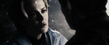 Movie still from “The Spirit” (2008), directed by Frank Miller – A person looking at the camera; Close Up shot, Over the shoulder angle