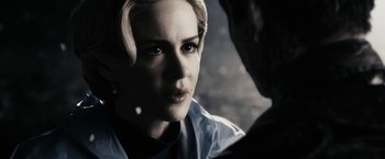 Movie still from “The Spirit” (2008), directed by Frank Miller – A person looking at the camera; Close Up shot, Over the shoulder angle