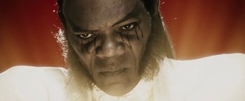 Movie still from “The Spirit” (2008), directed by Frank Miller – A person wearing a white shirt; Close Up shot, High angle