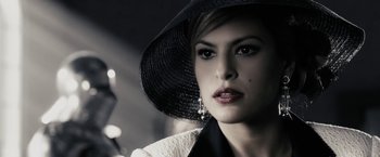 Movie still from “The Spirit” (2008), directed by Frank Miller – A person wearing a hat; Close Up shot, Over the shoulder angle