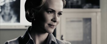 Movie still from “The Spirit” (2008), directed by Frank Miller – A woman's face in black - and - white photo; Close Up shot, Over the shoulder angle