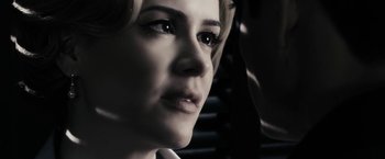 Movie still from “The Spirit” (2008), directed by Frank Miller – A woman's face in the dark; Extreme Close Up shot, Over the shoulder angle