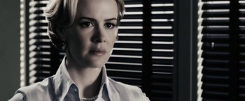 Movie still from “The Spirit” (2008), directed by Frank Miller – A person wearing a white shirt; Close Up shot, Over the shoulder angle