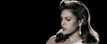 Movie still from “The Spirit” (2008), directed by Frank Miller – A beautiful woman with long dark brown hair; Close Up shot, Low angle