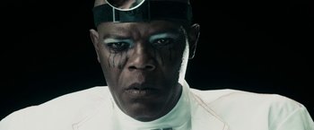 Movie still from “The Spirit” (2008), directed by Frank Miller – A person wearing a white shirt and tie; Close Up shot, Low angle