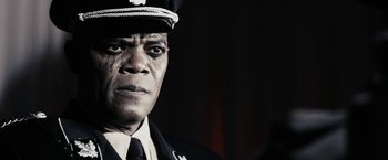 Movie still from “The Spirit” (2008), directed by Frank Miller – A man wearing a uniform and a hat; Close Up shot, Low angle