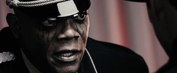 Movie still from “The Spirit” (2008), directed by Frank Miller – A person wearing a hat; Extreme Close Up shot, Low angle