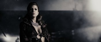 Movie still from “The Spirit” (2008), directed by Frank Miller – A beautiful woman wearing a necklace and a black dress; Medium shot, Low angle